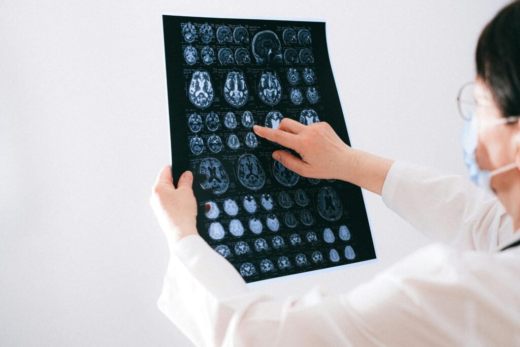 Doctor showing a patient highlighted MRI results.