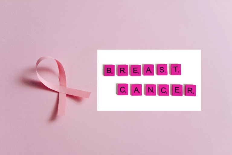 Pink Ribbon on Pink Surface with Scrabble Letter Tiles on White Background.