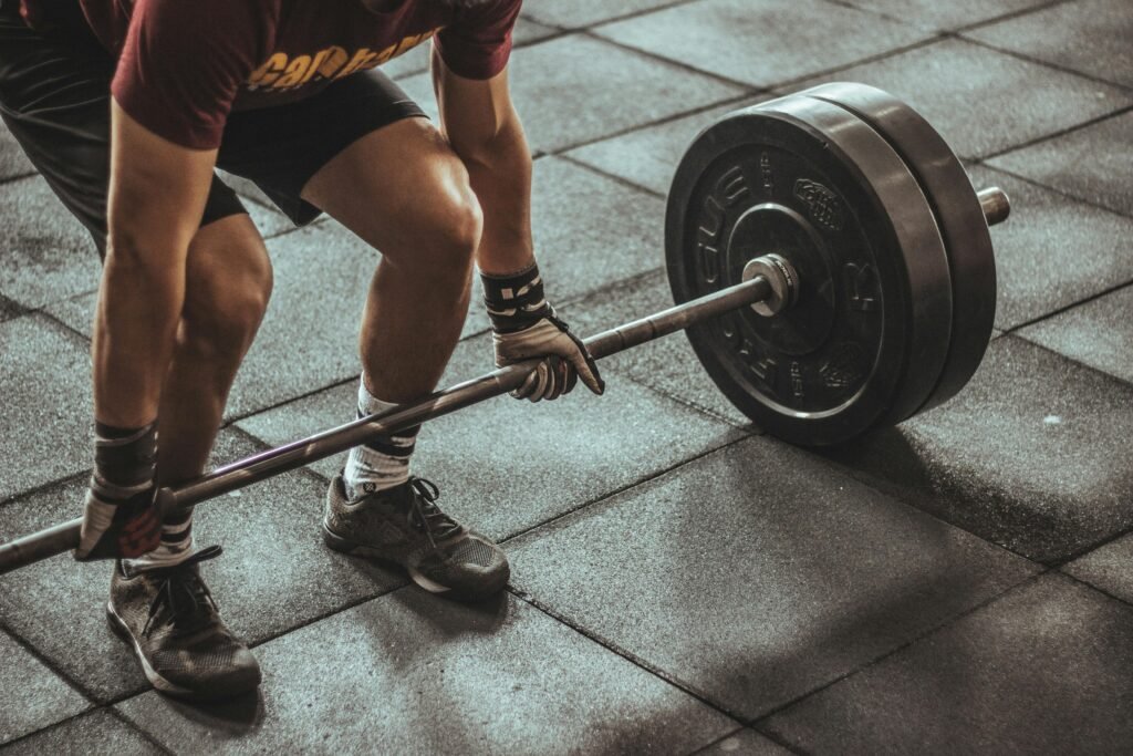 Person Holding Black and Silver Steel Barbell Photography.