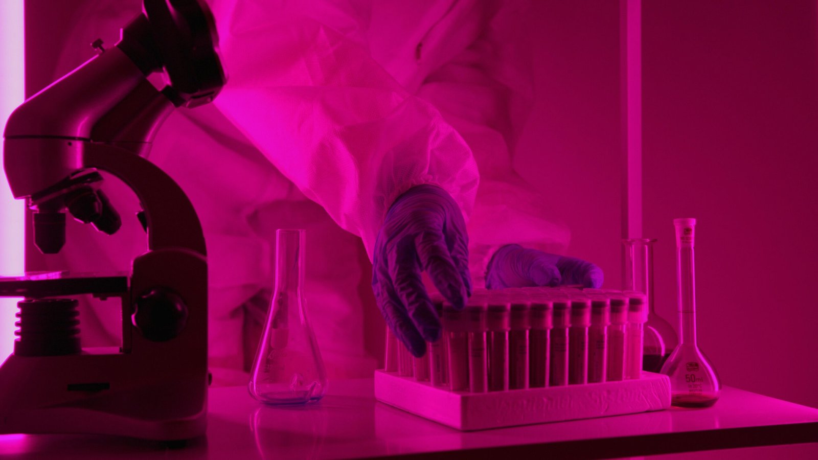 Scientist Holding Container with Vials