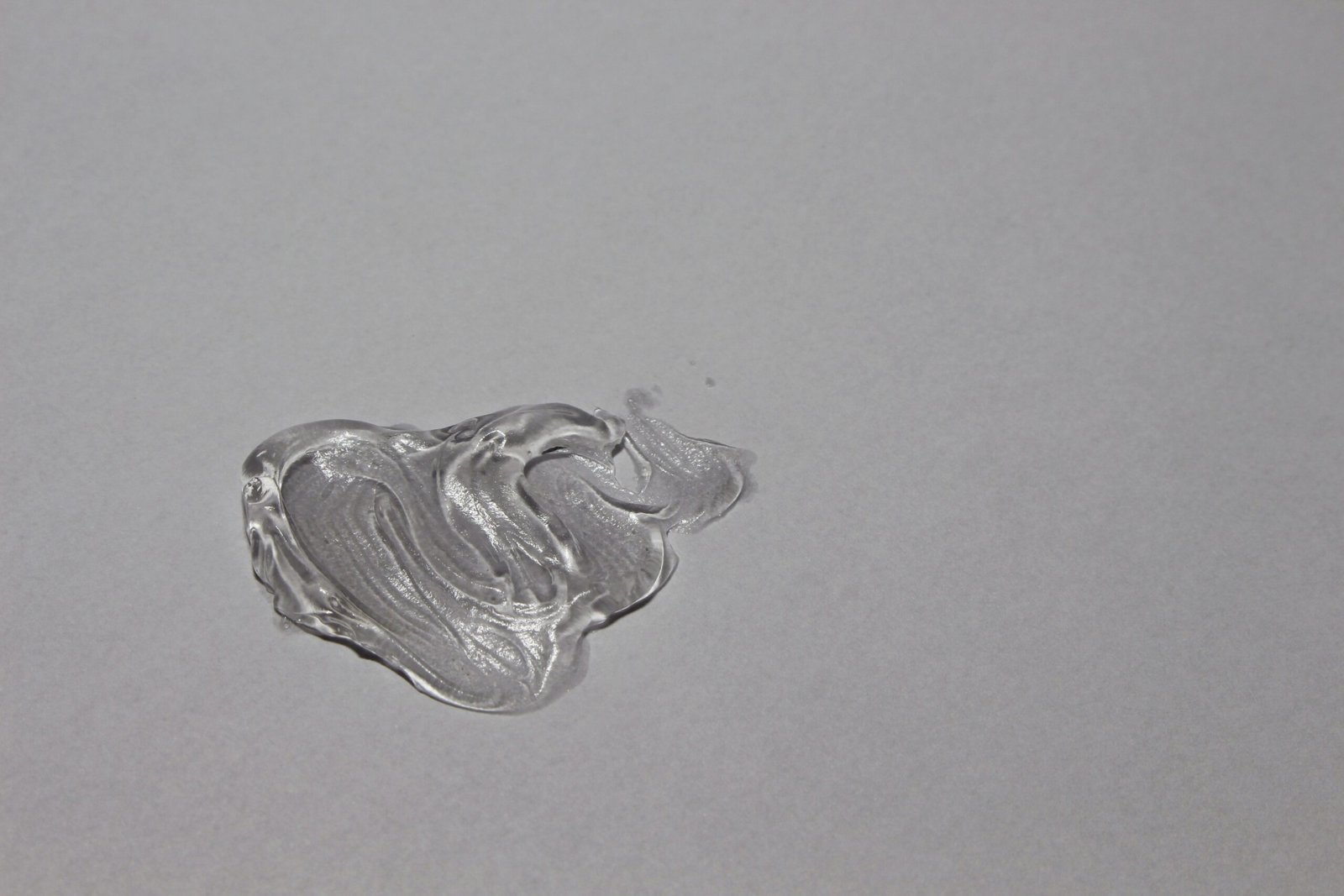 swatch of a transparent silicone substance on a white background