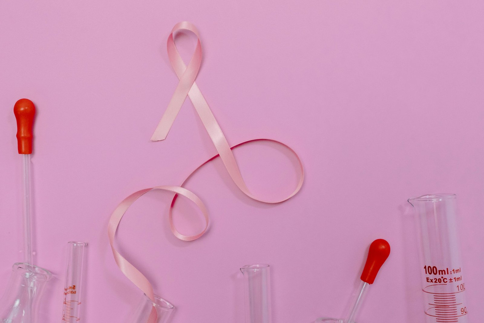 Pink ribbon symbolizing breast cancer.