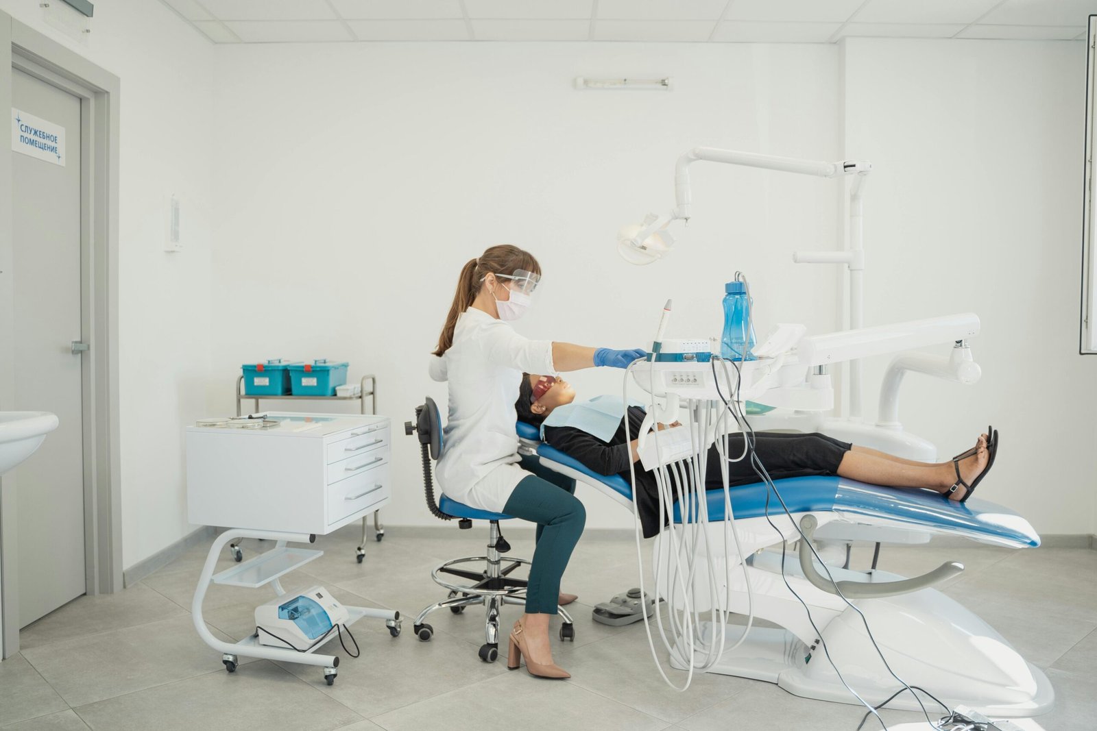 Dentist check her patient in the modern dental clinic.
